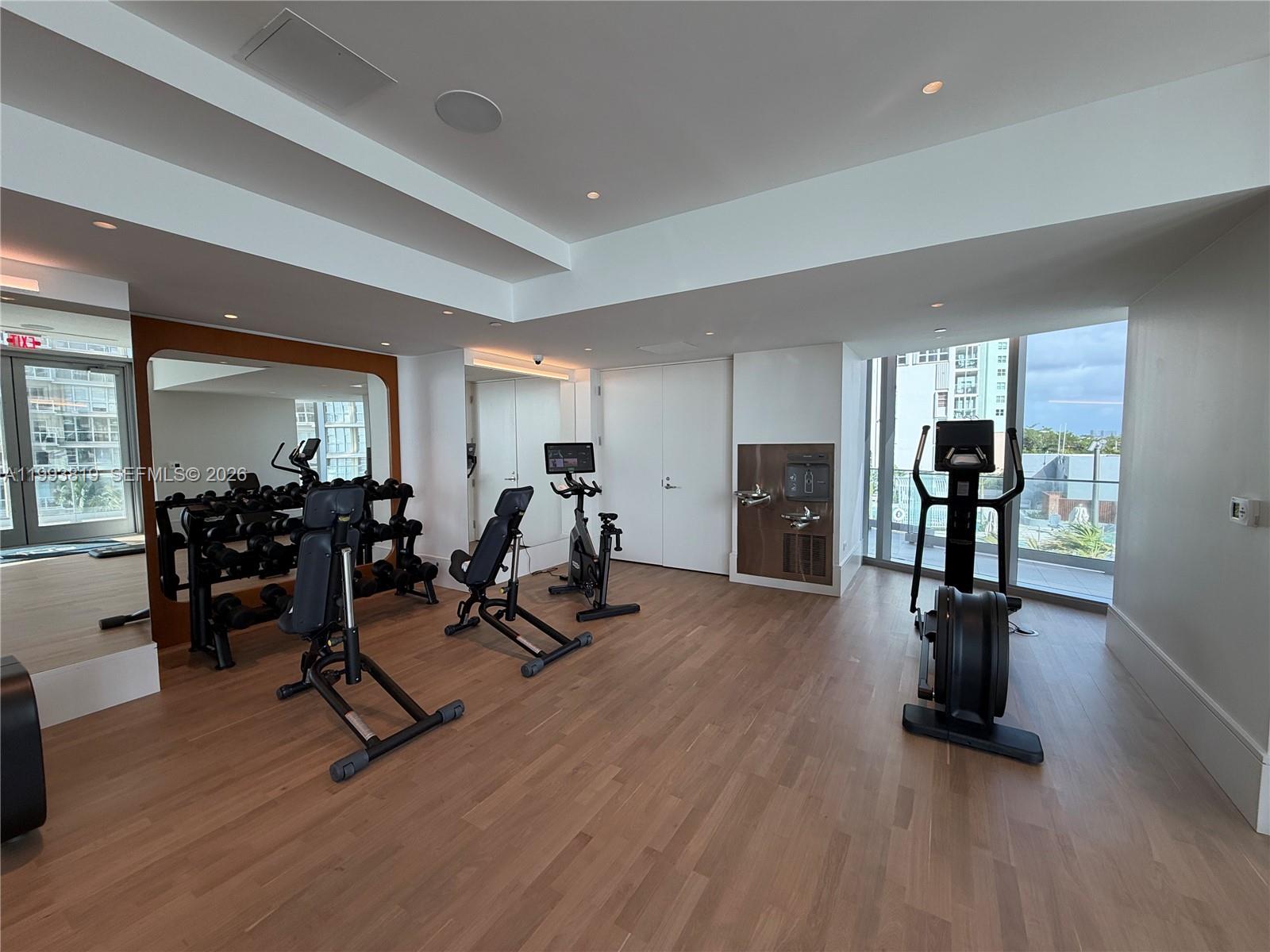 175 Southeast 25th Road, Unit 3102 Miami, FL 33129 - Photo 51 of 65 a view of a room with gym equipment and wooden floor