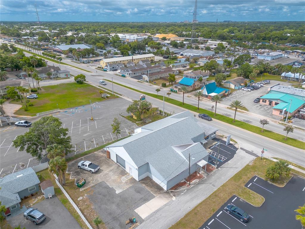 an aerial view of a house with a ocean view