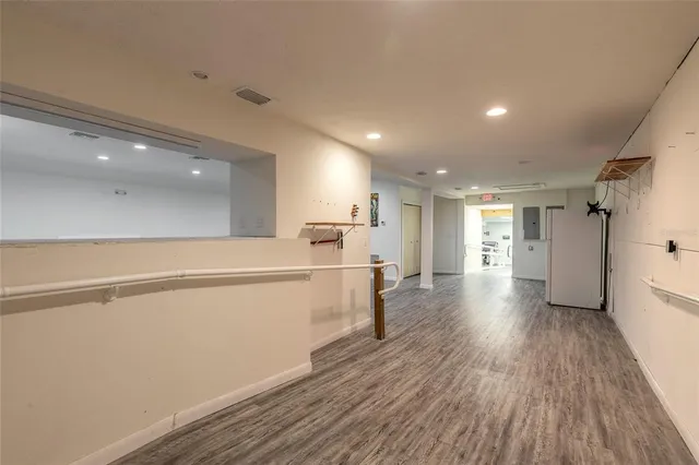 a view of a kitchen with a sink and a refrigerator