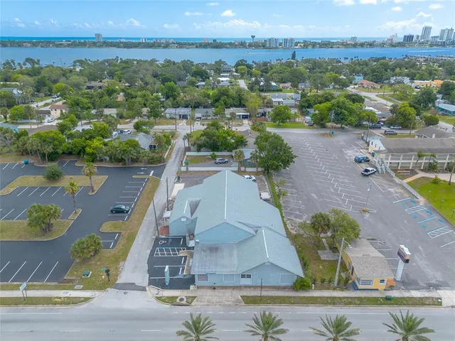 an aerial view of a house with a swimming pool