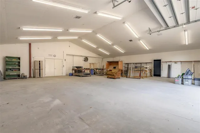 a view of a livingroom with furniture and a ceiling fan