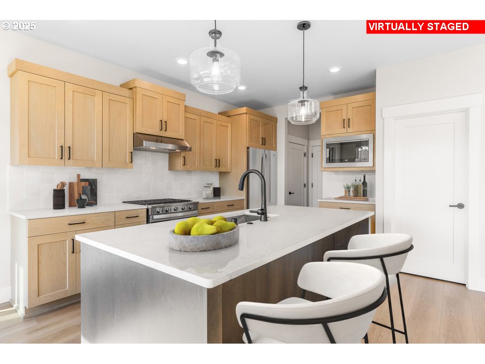 1172 Southeast 18th Avenue Canby, OR 97013 - Photo 3 of 16 a kitchen with a dining table chairs and white cabinets