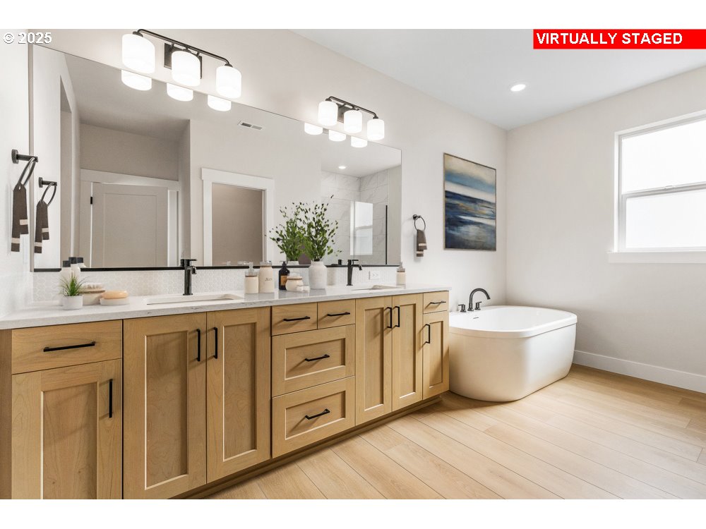 1172 Southeast 18th Avenue Canby, OR 97013 - Photo 6 of 16 a spacious bathroom with a granite countertop sink mirror and bathtub
