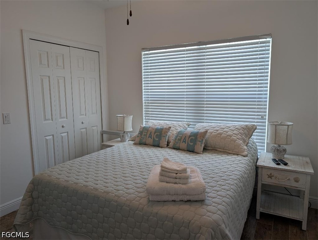 2579 Third Street Matlacha, FL 33993 - Photo 11 of 39 a bedroom with a large bed and a window