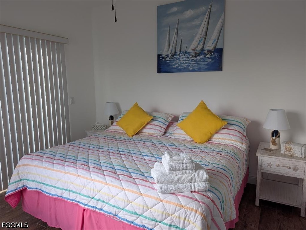 2579 Third Street Matlacha, FL 33993 - Photo 13 of 39 a bedroom with a bed and cupboard