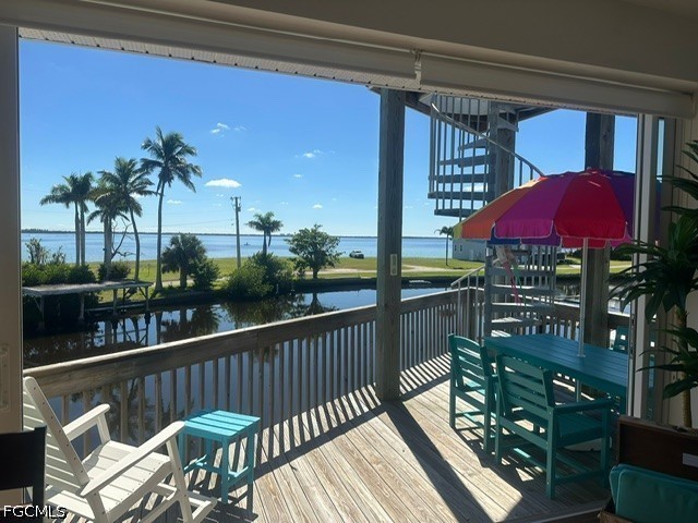 2579 Third Street Matlacha, FL 33993 - Photo 34 of 39 a view of a balcony with chairs and a potted plant