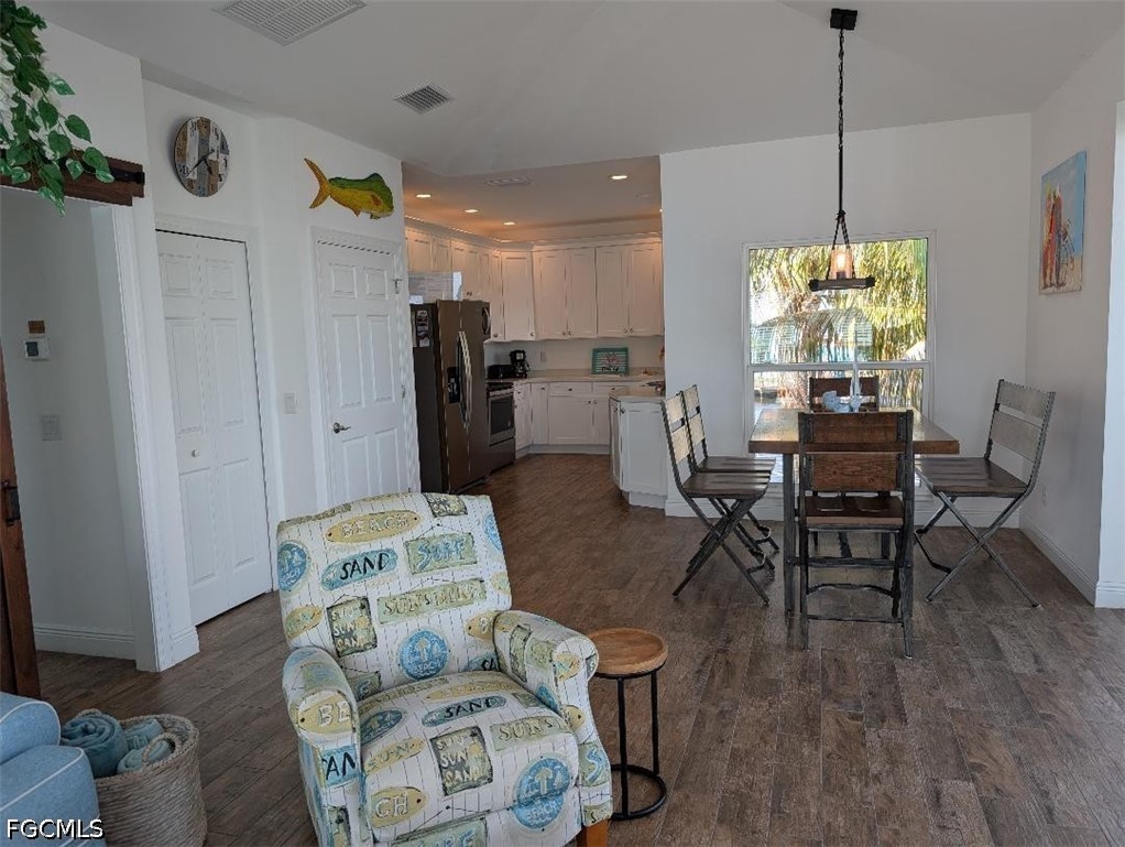 2579 Third Street Matlacha, FL 33993 - Photo 5 of 39 a living room with furniture and a chandelier