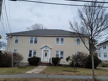 110 Clay Street, Unit 4 Quincy, MA 02170 - Photo 7 of 7 a view of a white house with a yard