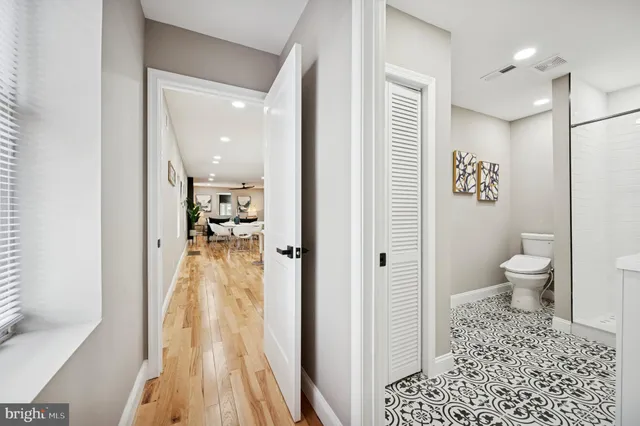 a bathroom with a toilet sink and shower