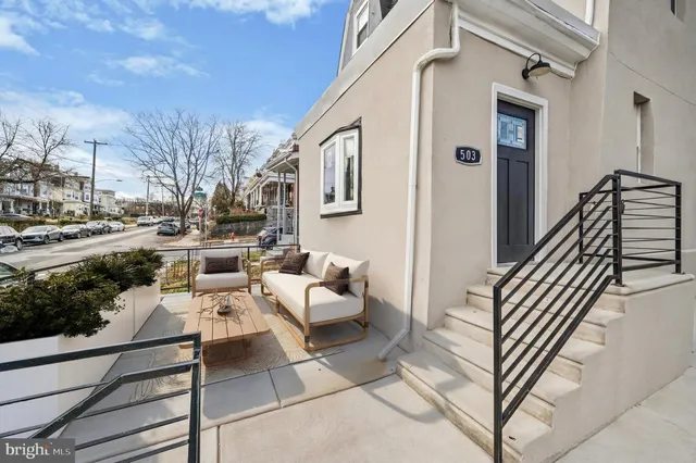 a view of a patio with couches and potted plants