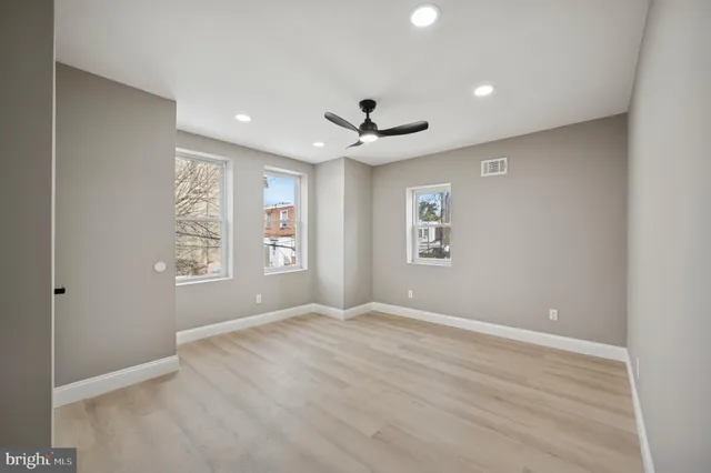 a view of a patio with couches fire pit and a barbeque