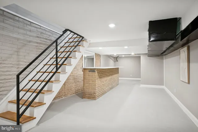 a bathroom with a sink toilet and mirror