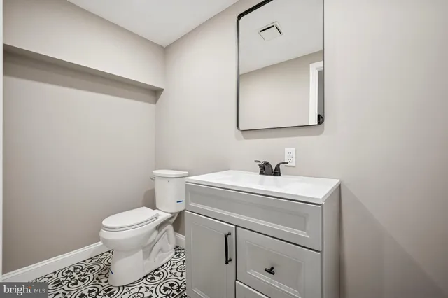 a front view of a house with parking space