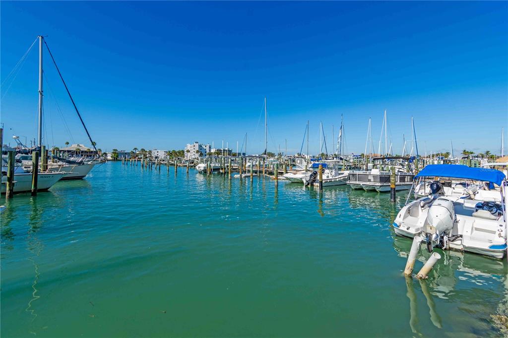 35 79th Terrace Treasure Island, FL 33706 - Photo 19 of 40 a view of a lake with lawn chairs