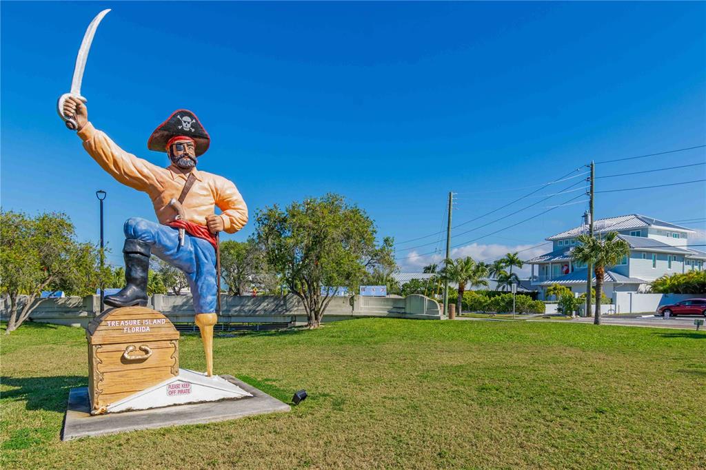 35 79th Terrace Treasure Island, FL 33706 - Photo 20 of 40 a front view of a house with a yard
