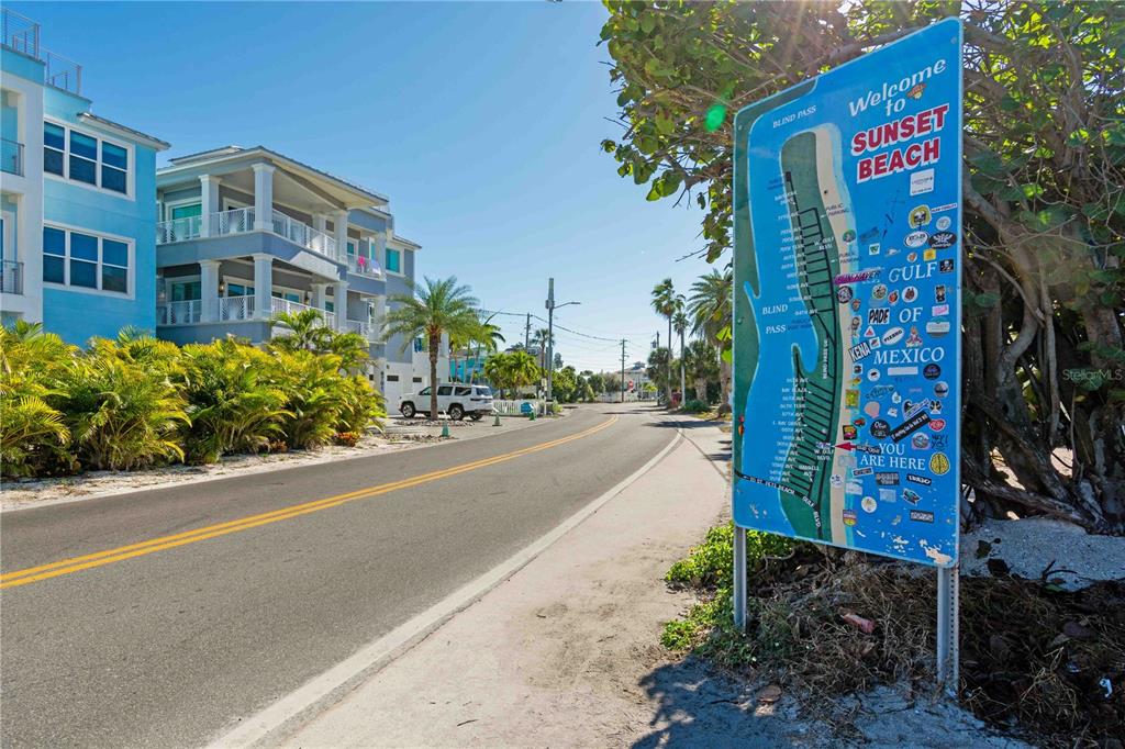 35 79th Terrace Treasure Island, FL 33706 - Photo 4 of 40 a street sign on a sidewalk next to a building