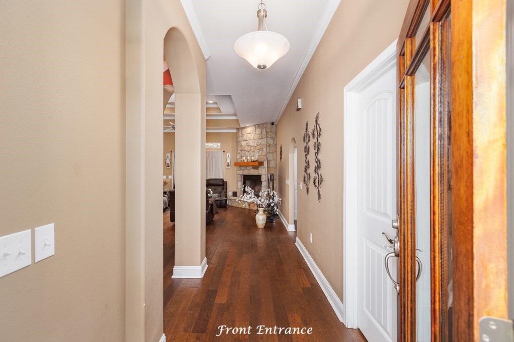 1171 Old Ewing Road Lufkin, TX 75901 - Photo 2 of 49 a view of a hallway with wooden floor and staircase