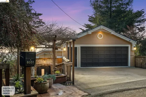 a front view of a house with parking space and garage