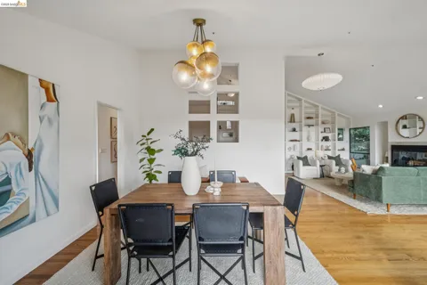 a kitchen with kitchen island granite countertop a sink cabinets and wooden floor