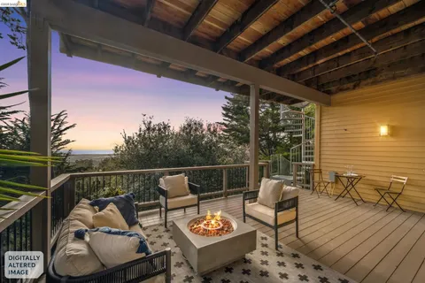a view of a balcony with furniture and rug