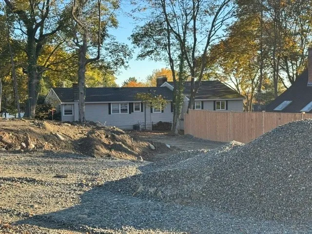a view of a house with a snow in the yard