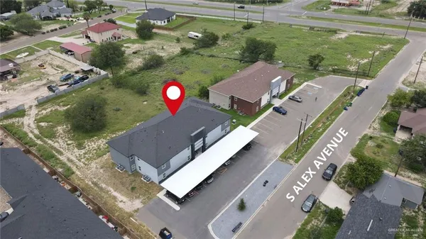 an aerial view of a house with outdoor space