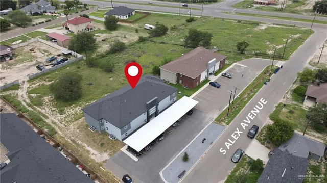 an aerial view of a house with outdoor space