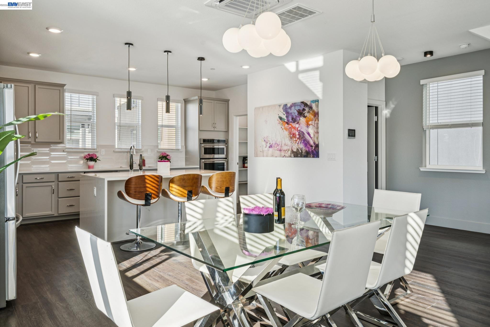 646 Eucalyptus Way Alameda, CA 94501 - Photo 16 of 40 a view of a dining room with furniture a chandelier and wooden floor