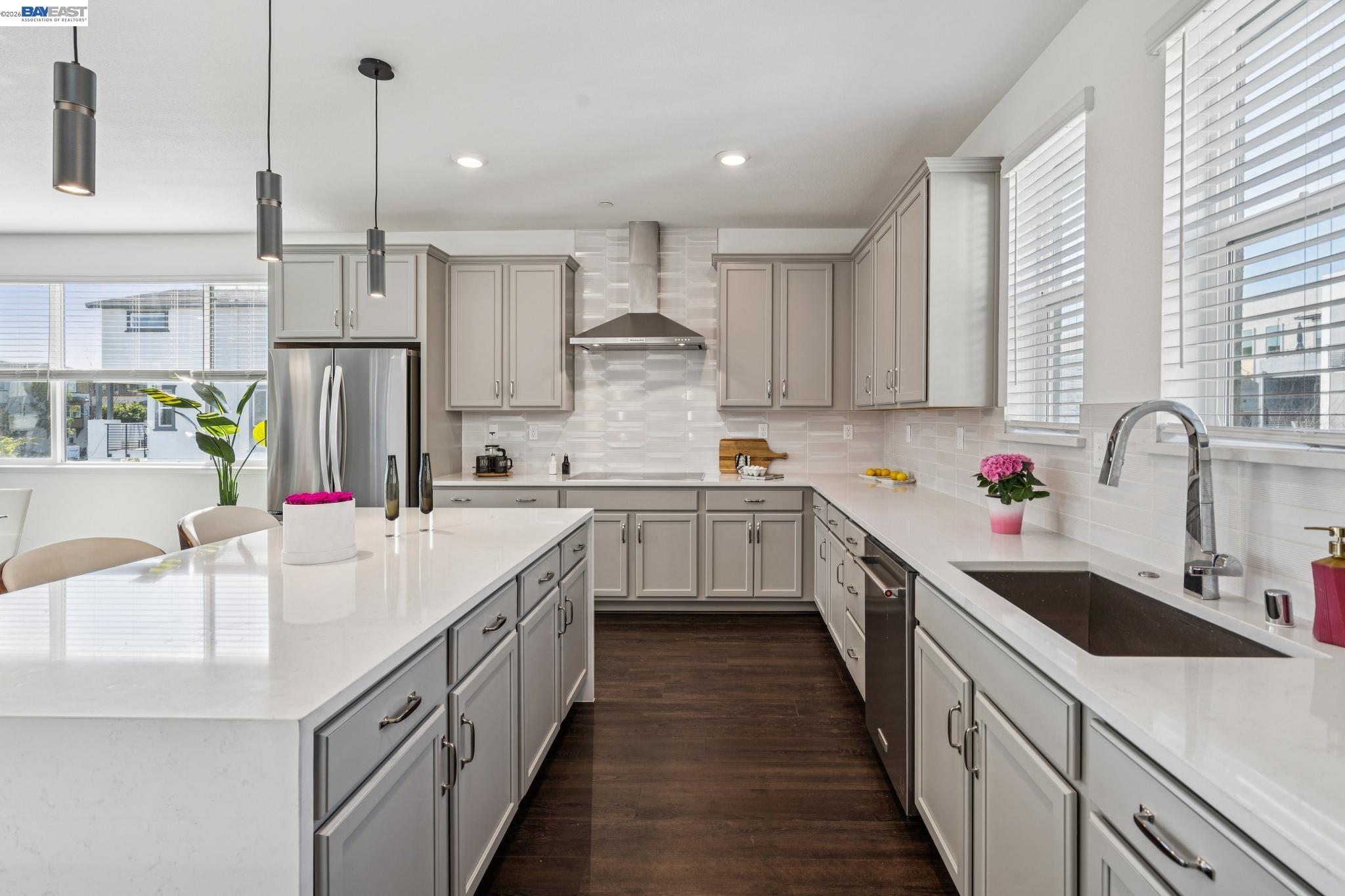 646 Eucalyptus Way Alameda, CA 94501 - Photo 18 of 40 a kitchen with kitchen island white cabinets and white appliances