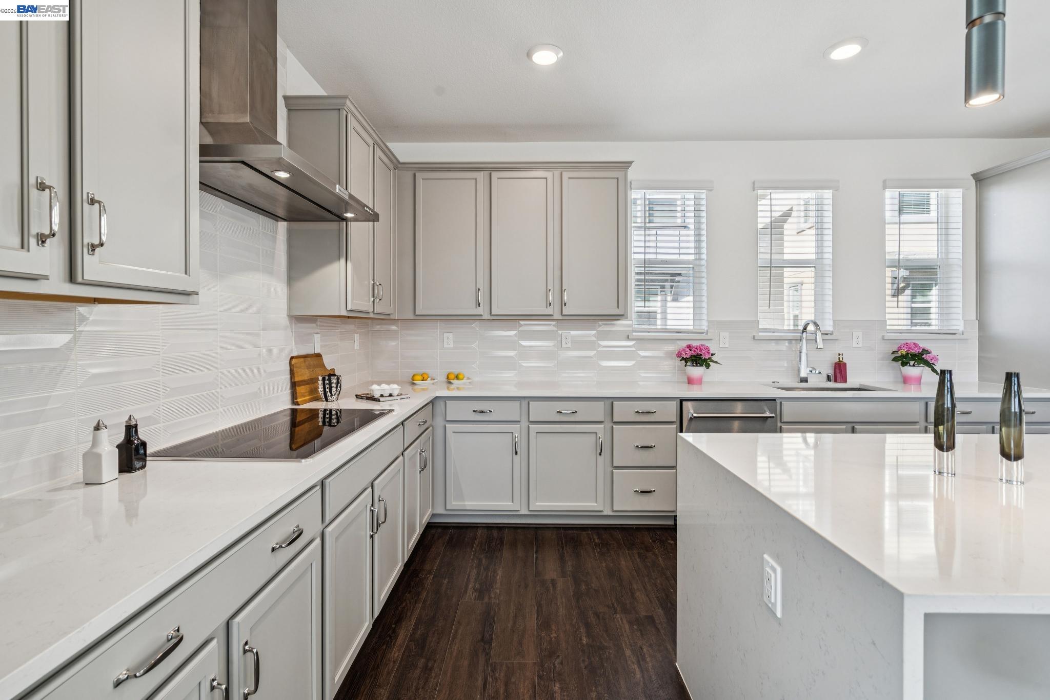 646 Eucalyptus Way Alameda, CA 94501 - Photo 19 of 40 a kitchen with granite countertop a sink stainless steel appliances and cabinets