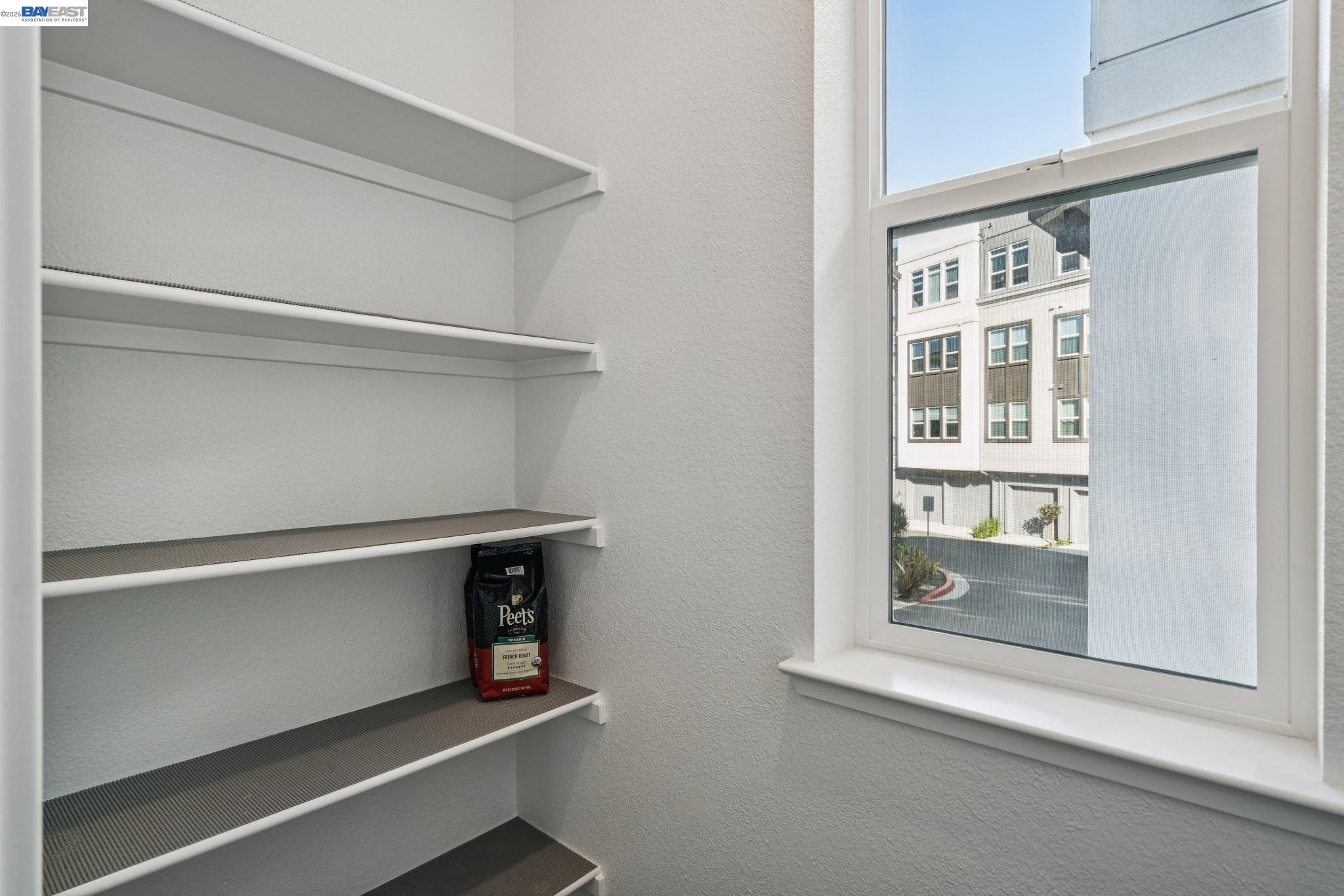 646 Eucalyptus Way Alameda, CA 94501 - Photo 20 of 40 a view of an empty room with wooden floor and a window