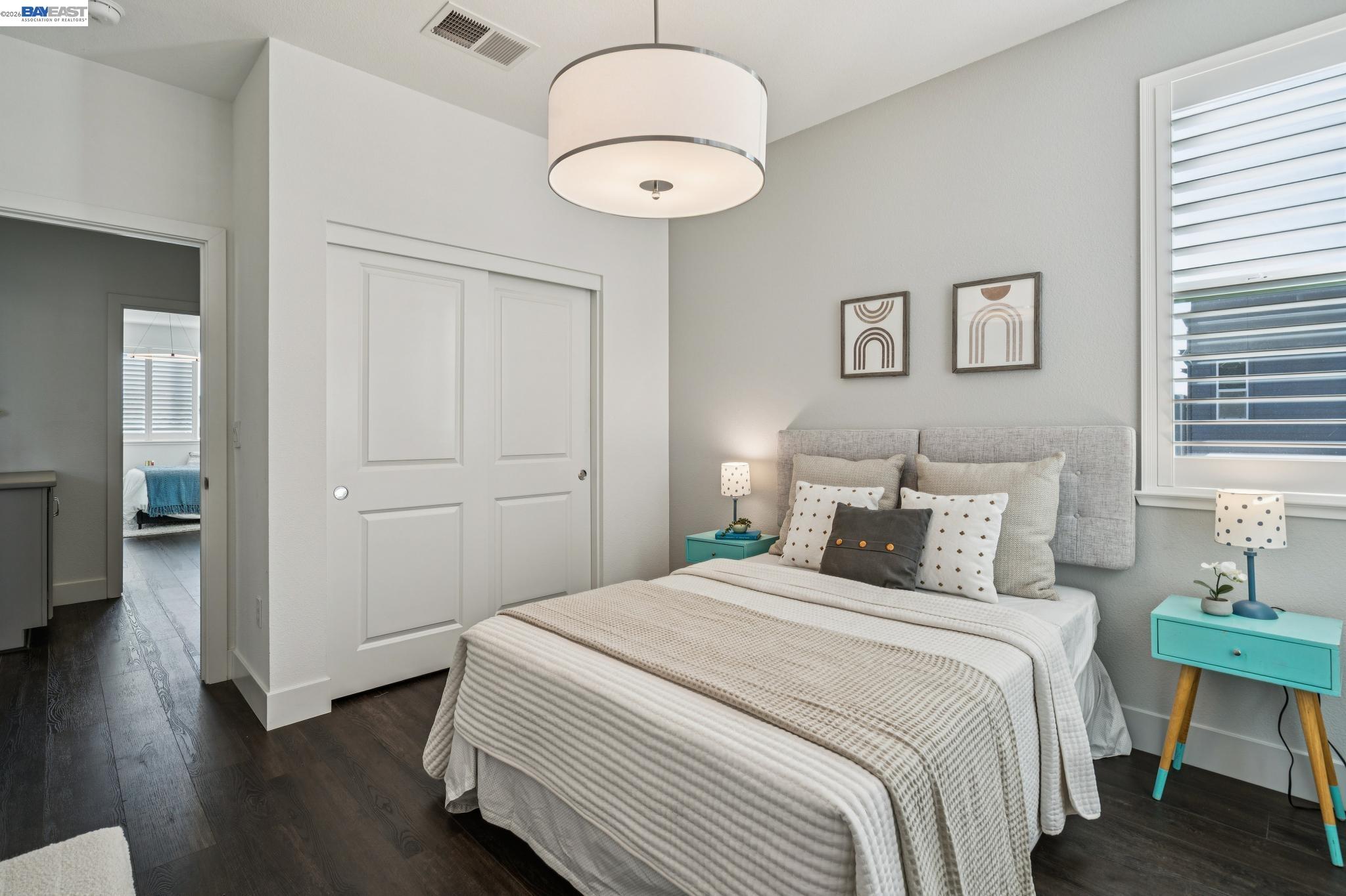 646 Eucalyptus Way Alameda, CA 94501 - Photo 32 of 40 a bedroom with bed and a chandelier