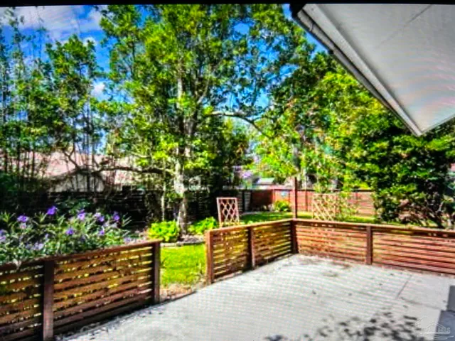 a view of a garden with an outdoor seating