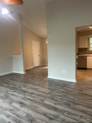 a view of a kitchen cabinets and wooden floor