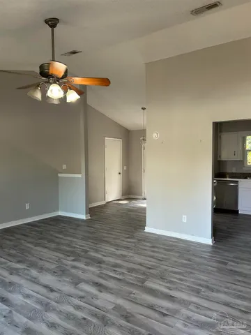 a view of a kitchen with a dishwasher and wooden floor