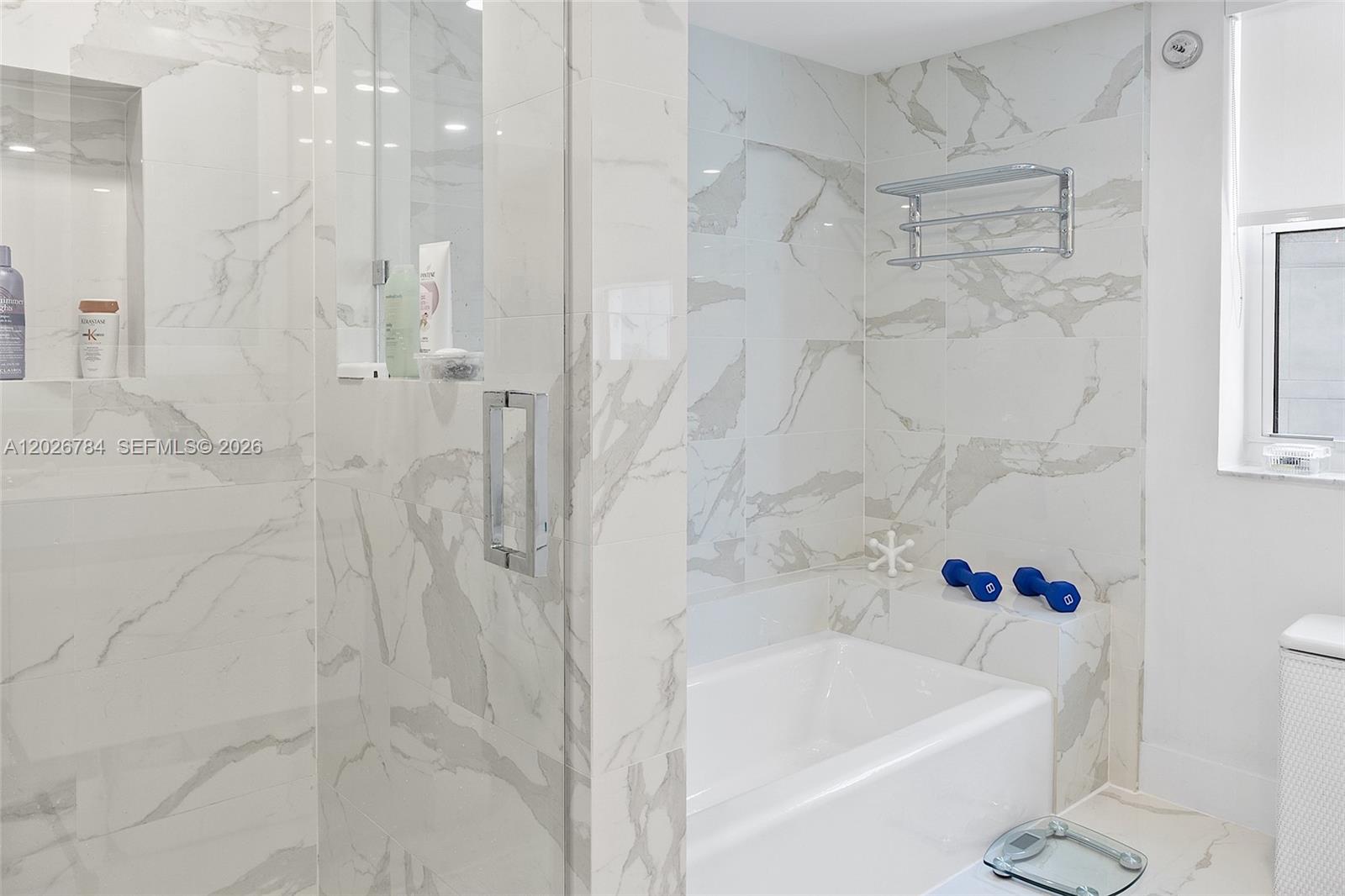 151 Southeast 15th Road, Unit 601 Miami, FL 33129 - Photo 21 of 36 a bathroom with a bathtub and shower