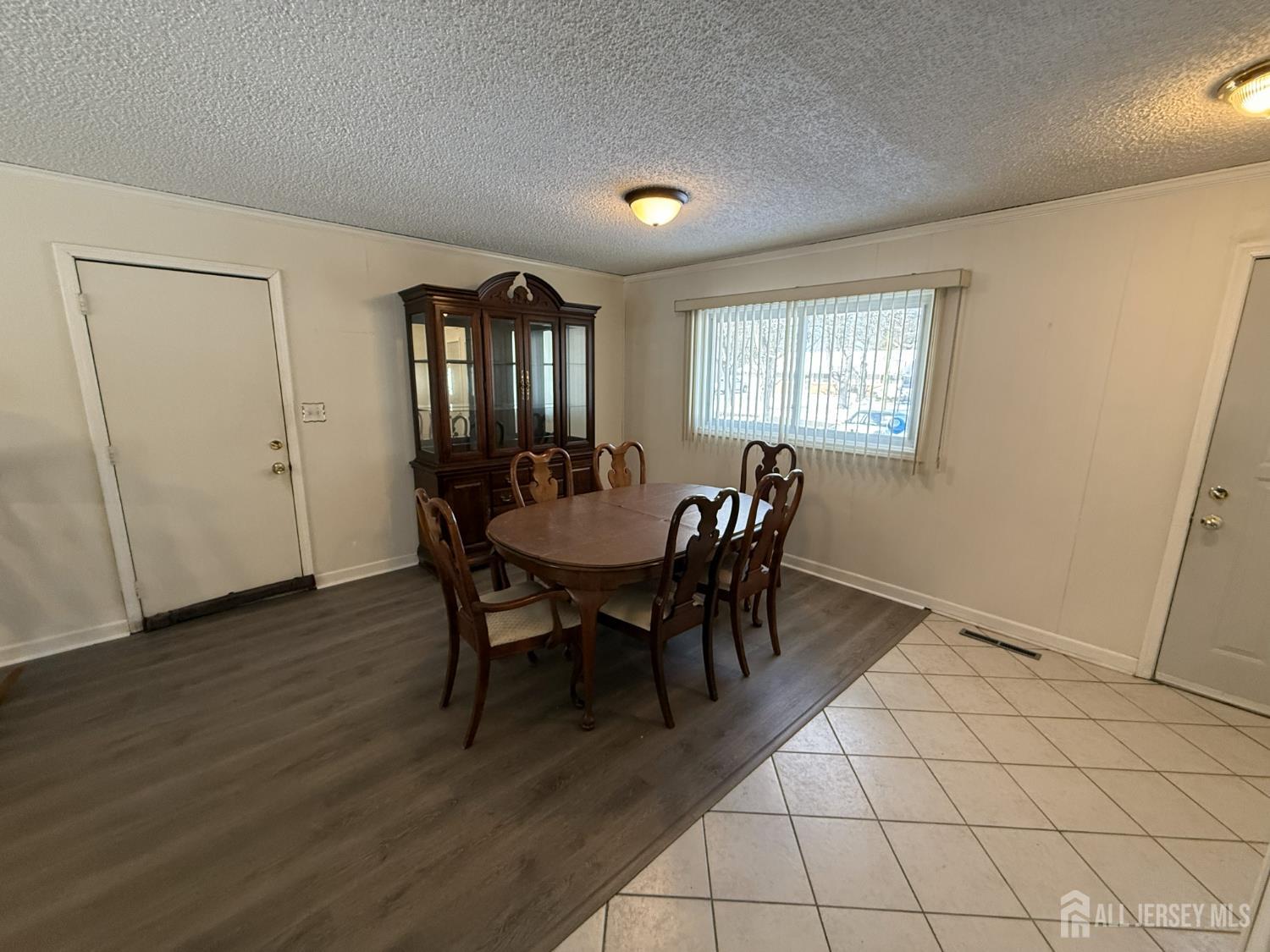 10 Tyndall Road Kendall Park, NJ 08824 - Photo 2 of 25 a view of a dining room with furniture and window