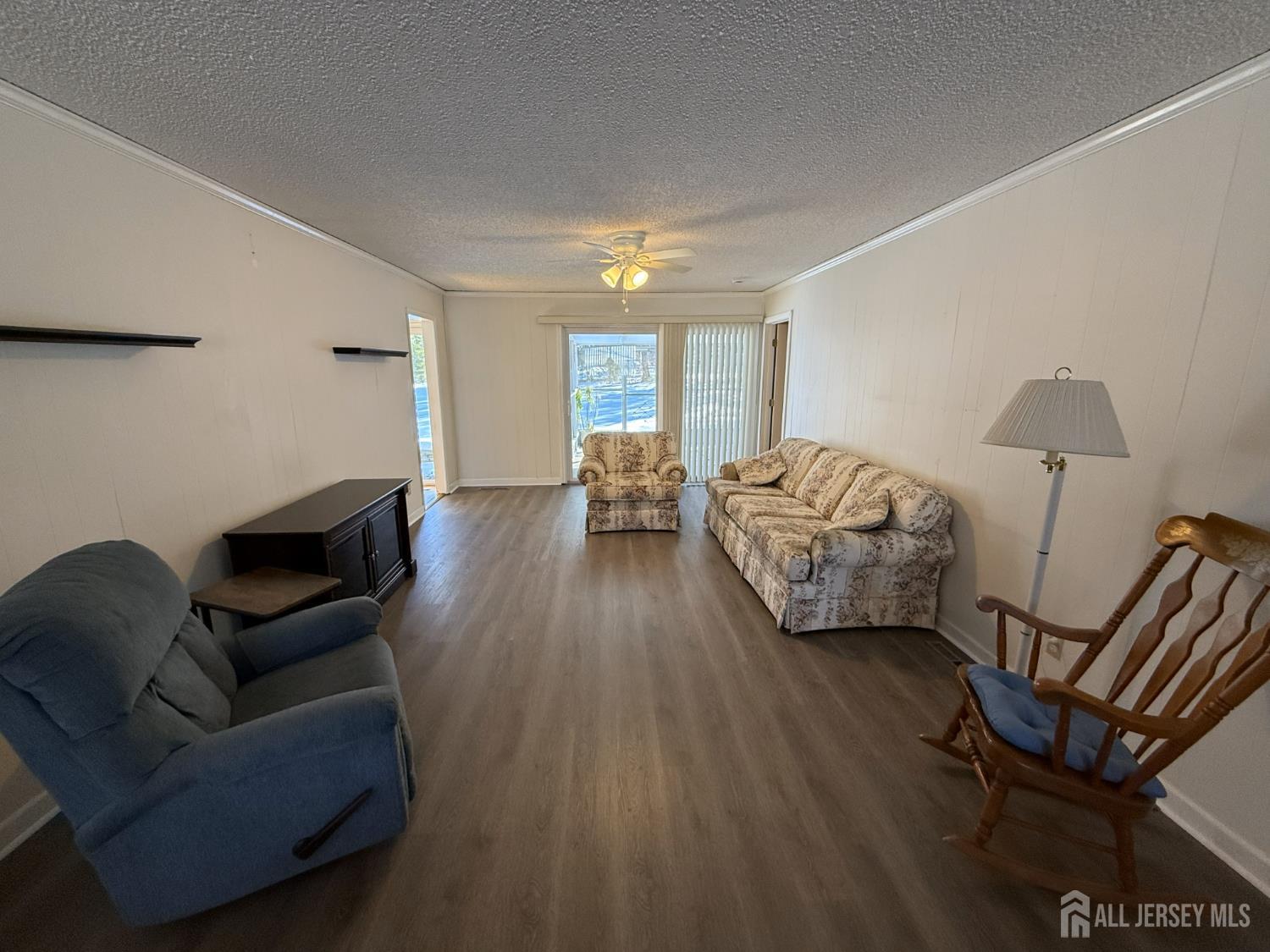 10 Tyndall Road Kendall Park, NJ 08824 - Photo 6 of 25 a living room with furniture and a wooden floor