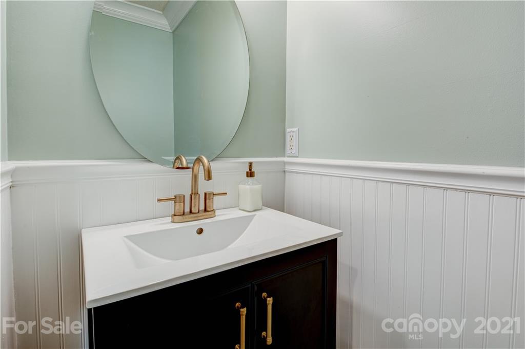 127 Yadkin Road Fletcher, NC 28732 - Photo 11 of 25 a bathroom with a sink and a mirror
