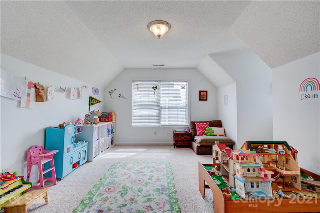 127 Yadkin Road Fletcher, NC 28732 - Photo 20 of 25 a room with toys and a couch