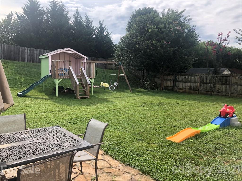 127 Yadkin Road Fletcher, NC 28732 - Photo 22 of 25 a view of a house with backyard