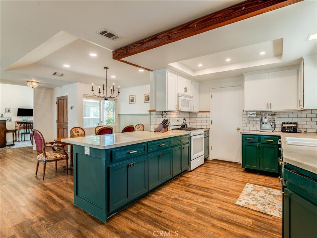 5435 Del Norte Way Santa Maria, CA 93455 - Photo 19 of 60 a kitchen with kitchen island granite countertop a sink and counter top space