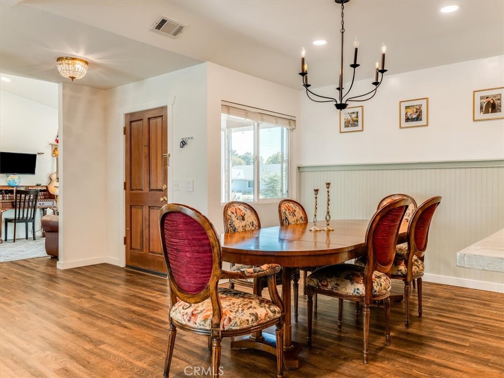 5435 Del Norte Way Santa Maria, CA 93455 - Photo 21 of 60 a dining room with furniture a chandelier and wooden floor
