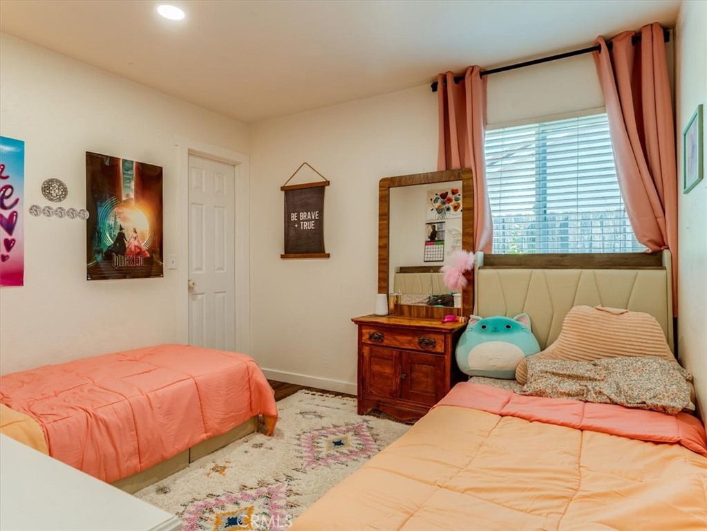 5435 Del Norte Way Santa Maria, CA 93455 - Photo 33 of 60 a bedroom with a bed and dresser with mirror