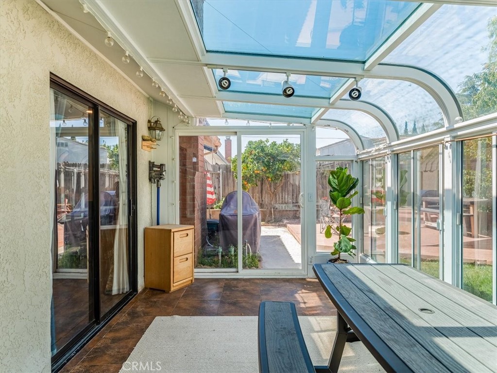 5435 Del Norte Way Santa Maria, CA 93455 - Photo 36 of 60 a view of a porch with furniture wooden floor and windows