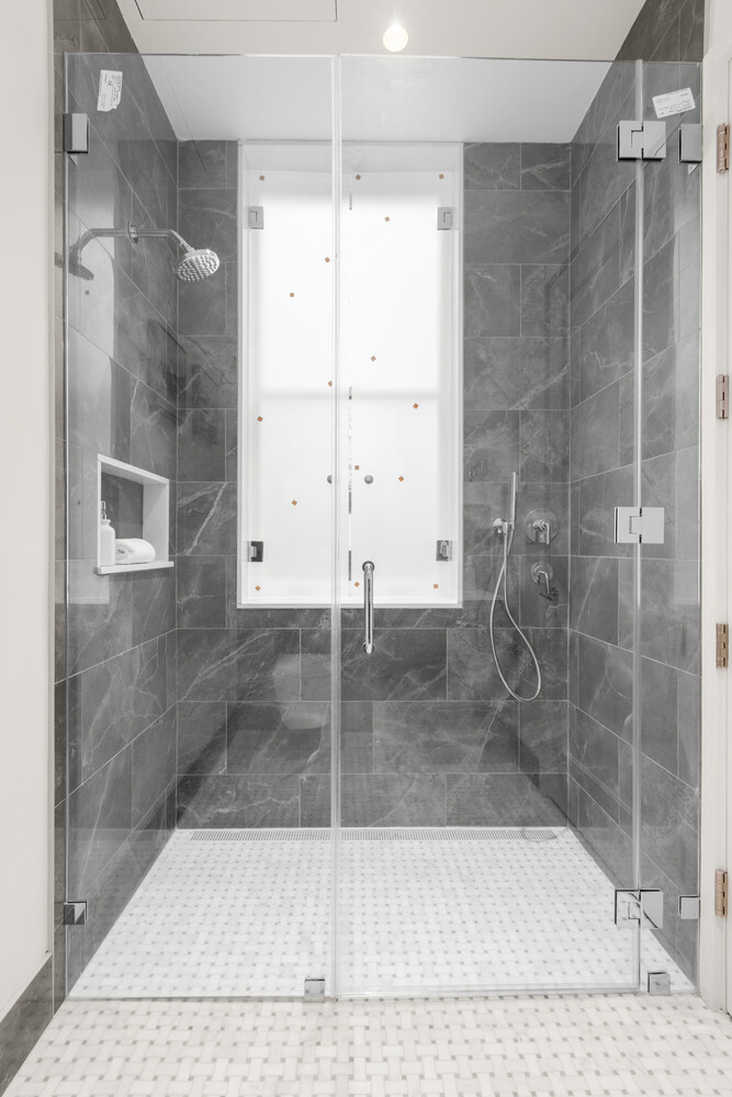 46 East 65th Street, Unit 4 Manhattan, NY 10065 - Photo 12 of 18 a bathroom with a shower