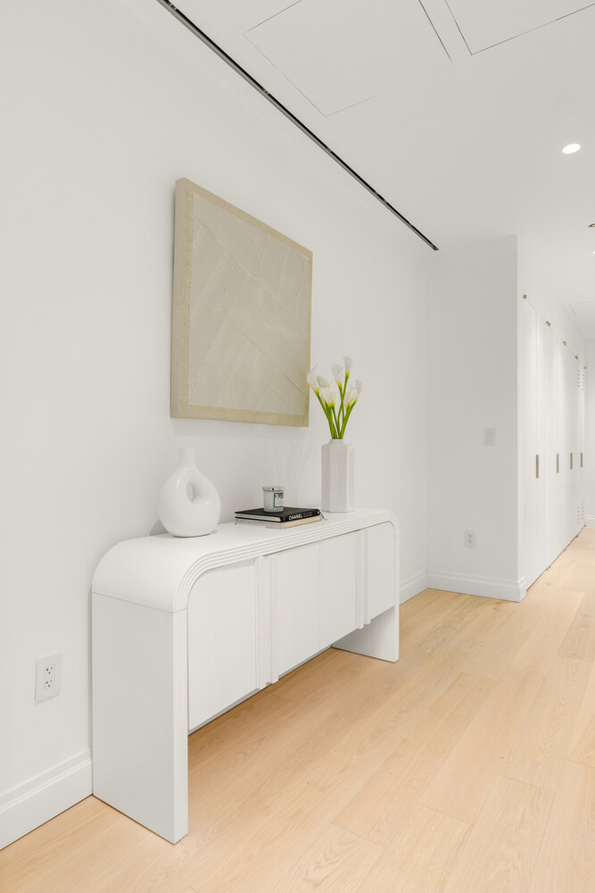 46 East 65th Street, Unit 4 Manhattan, NY 10065 - Photo 9 of 18 a bathroom with a granite countertop sink and a bathtub