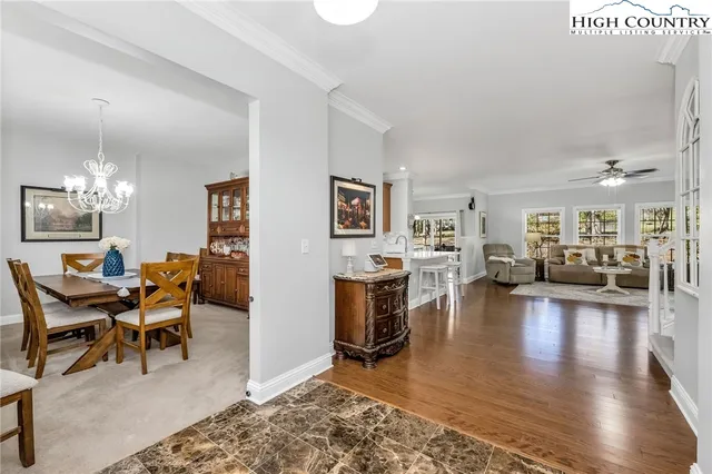 a kitchen with stainless steel appliances granite countertop a sink refrigerator and cabinets