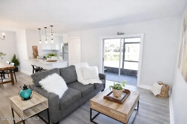 a kitchen with kitchen island a sink and a refrigerator