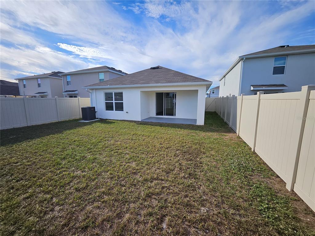 2636 Hardin Way Zephyrhills, FL 33541 - Photo 31 of 42 a view of a house with a yard